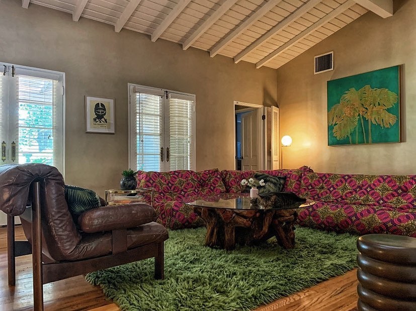 Moss-green high-pile rug in an eclectic residential lounge