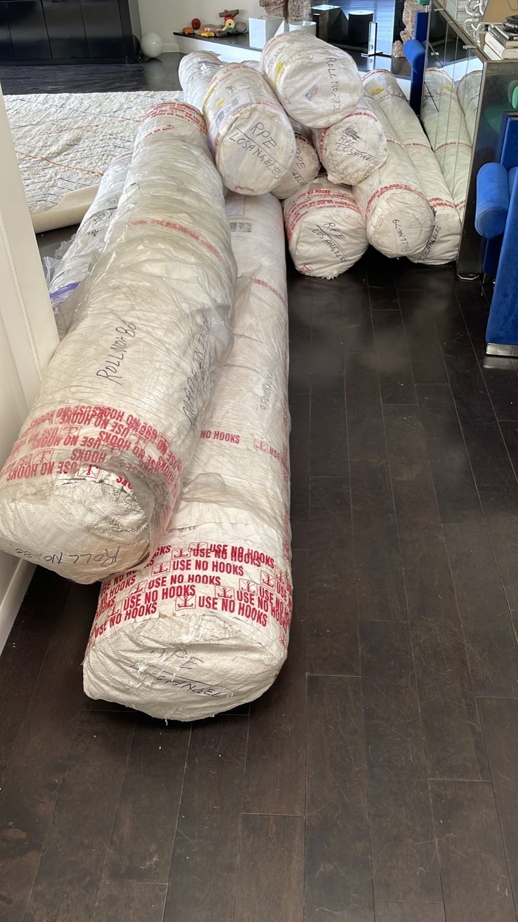 Protected rug rolls prepared for onward delivery
